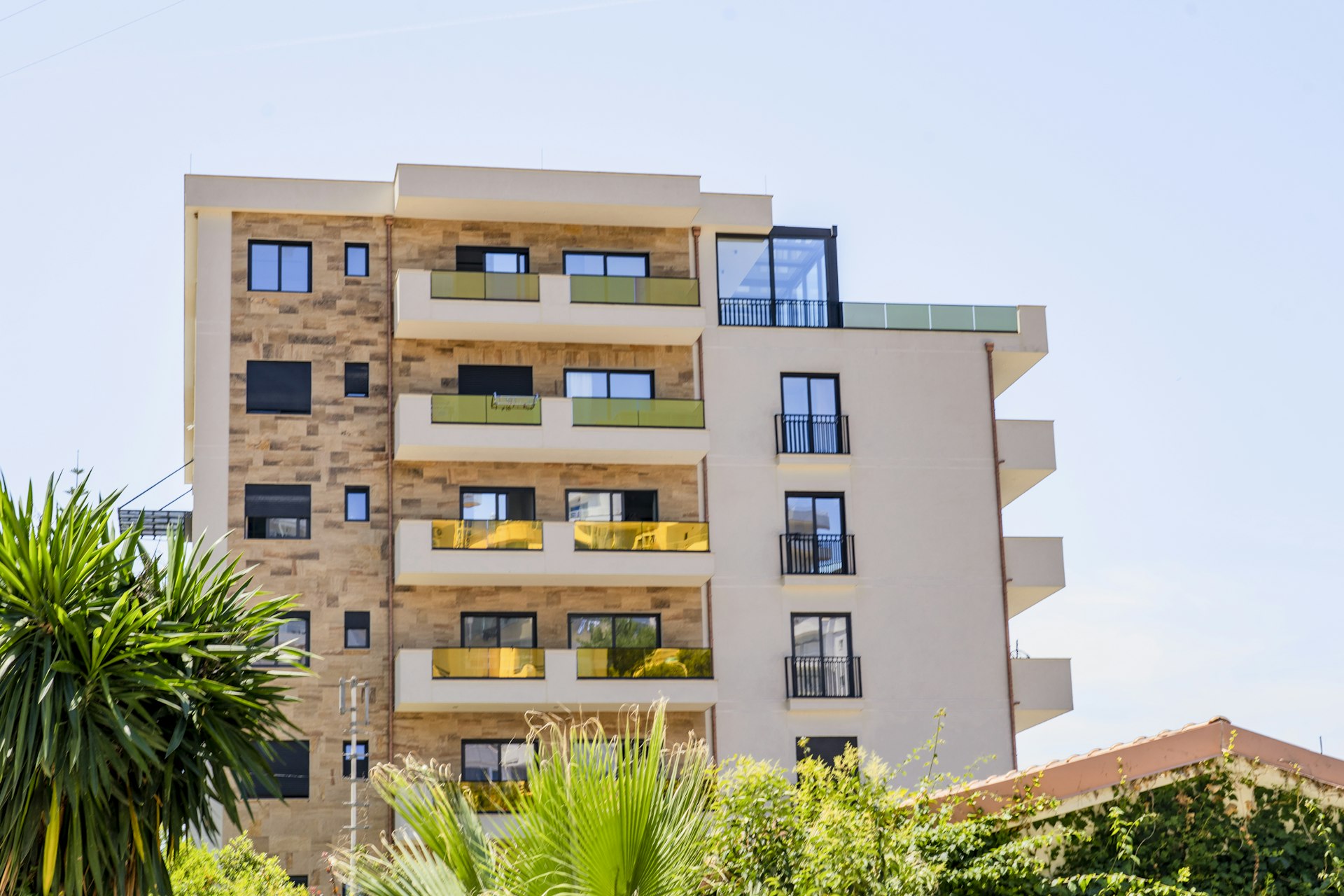 Apartment building exterior with palm trees