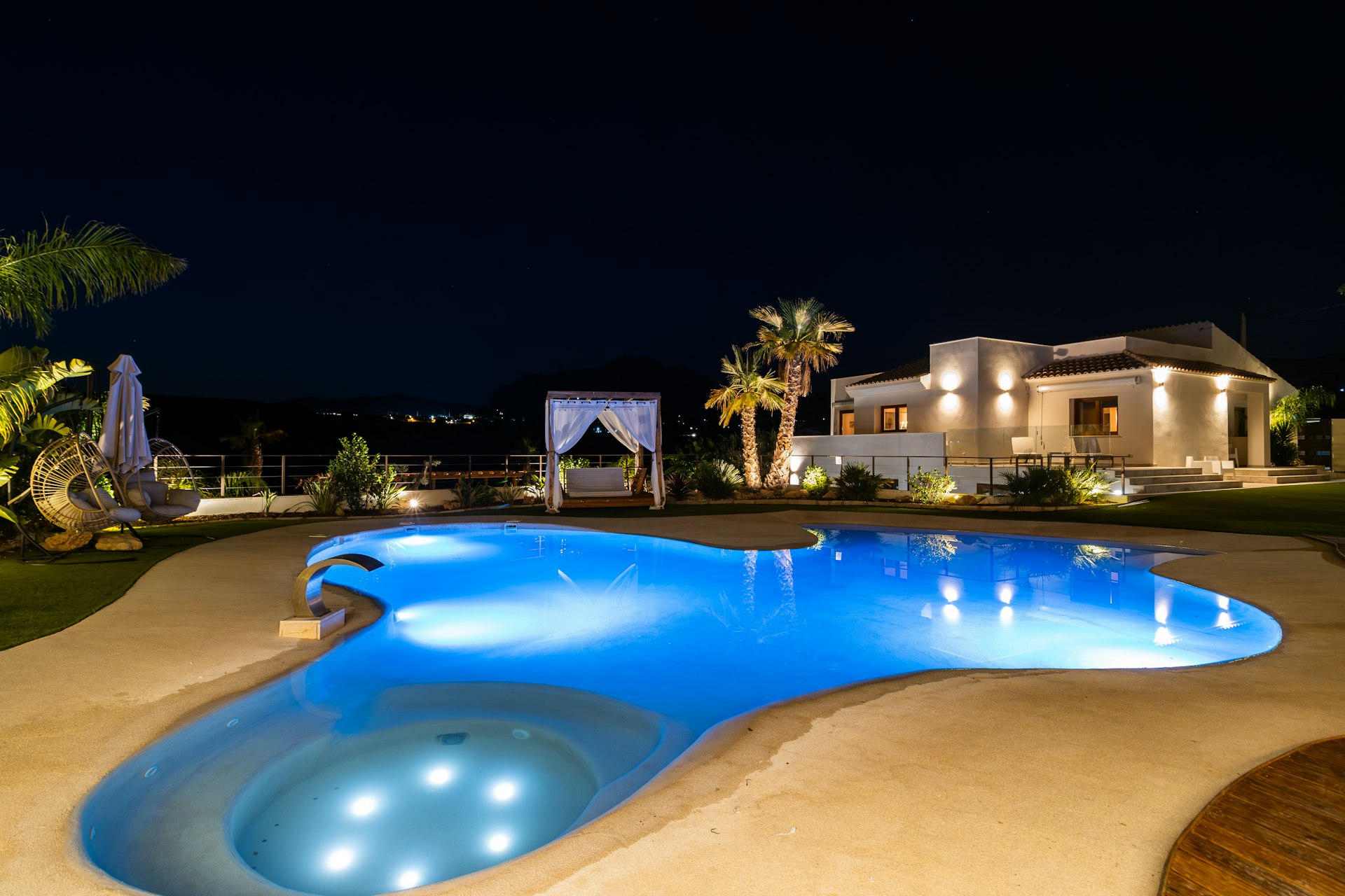 Illuminated pool deck in the evening